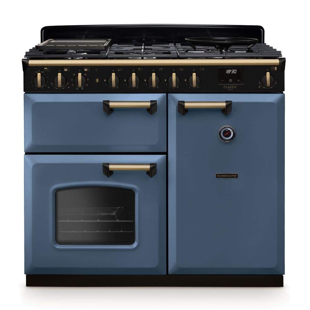 Classic Deluxe 100cm dual fuel range cooker in stone blue with antique brass accents, featuring six gas burners, an oven with a glass door, and stylish knobs.