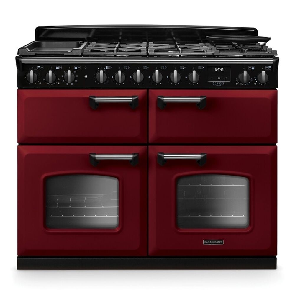 Classic Deluxe 110cm dual fuel range cooker in Bordeaux red and chrome, featuring four gas burners, a griddle, and two large glass ovens with chrome handles.