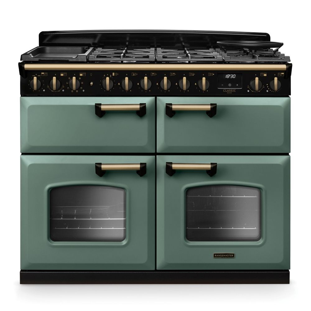 Classic Deluxe 110cm dual fuel range cooker in mineral green with antique brass accents, featuring four gas burners, two ovens with glass doors, and a stylish design.