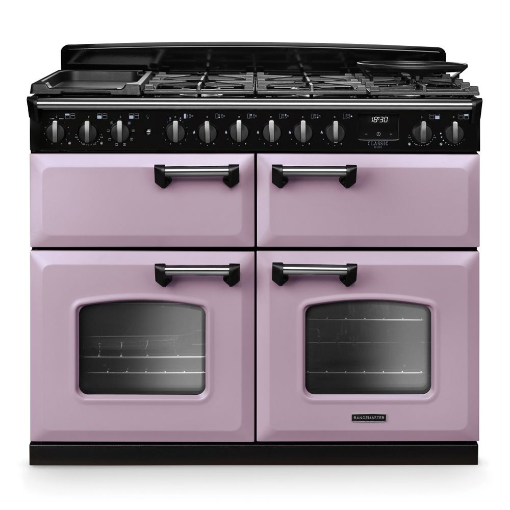 Classic Deluxe 110cm dual fuel range cooker in BC Heather with chrome accents, featuring four gas burners, two ovens, and a sleek design with pink doors and black control panel.