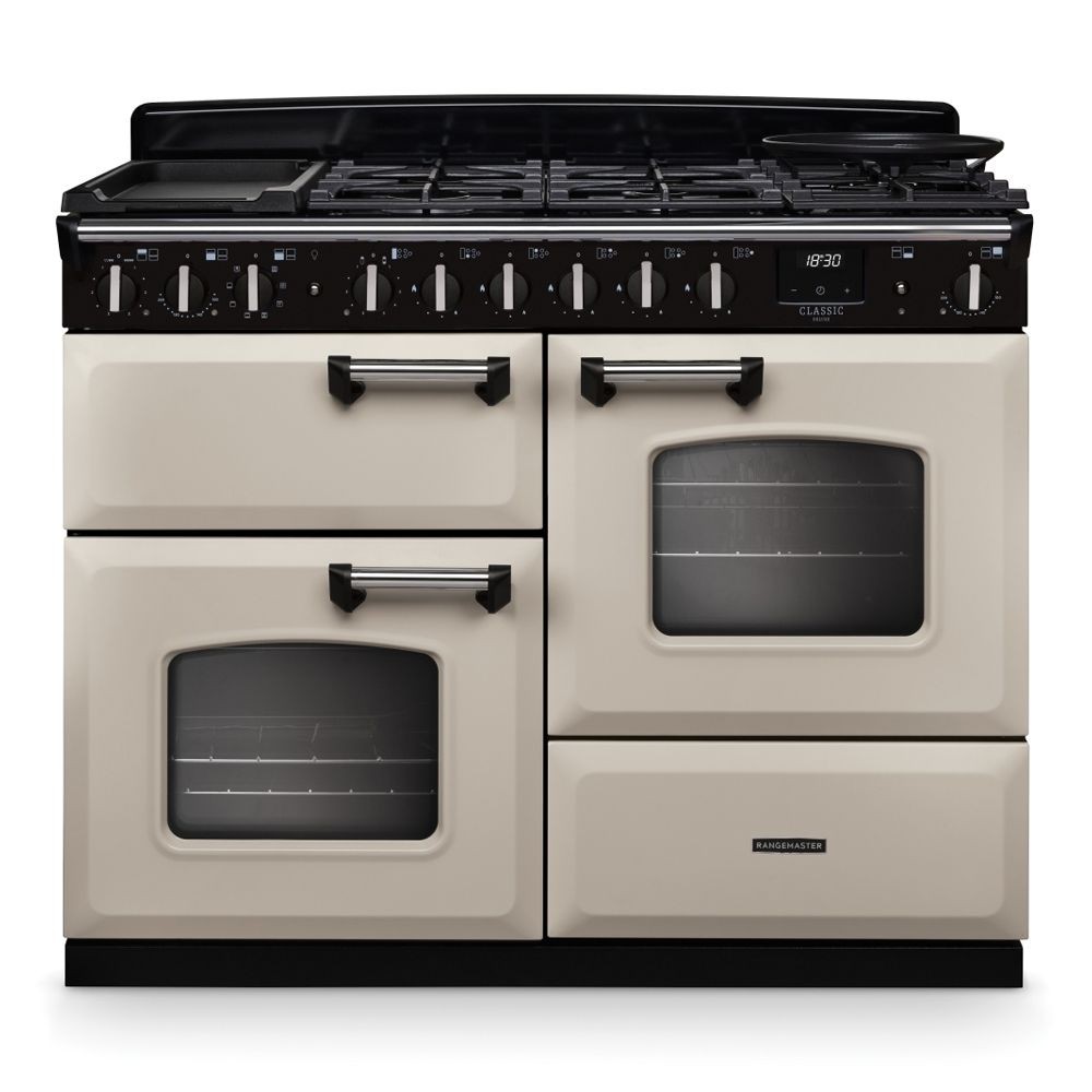 Classic Deluxe 110cm dual fuel range cooker in pale cream with chrome accents, featuring four gas burners, two ovens, and a griddle, showcasing a sleek, retro design.