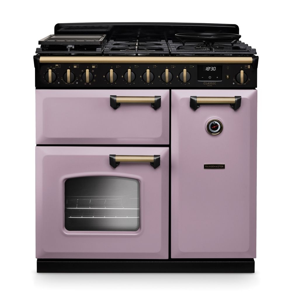 Classic Deluxe 90cm dual fuel range cooker in heather with antique brass accents, featuring a black gas hob, two ovens, and distinctive control knobs.