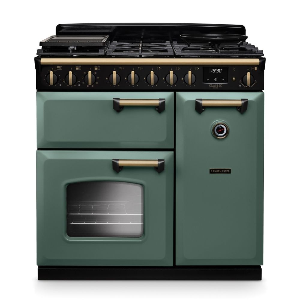 Classic Deluxe 90cm dual fuel range cooker in mineral green with antique brass accents, featuring multiple burners, a large oven, and a sleek black top.