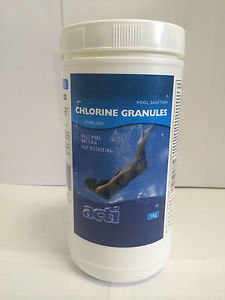 White plastic container with a blue label, featuring a swimmer and text reading "Chlorine Granules" for pool sanitation, 1kg size by ClearWater.