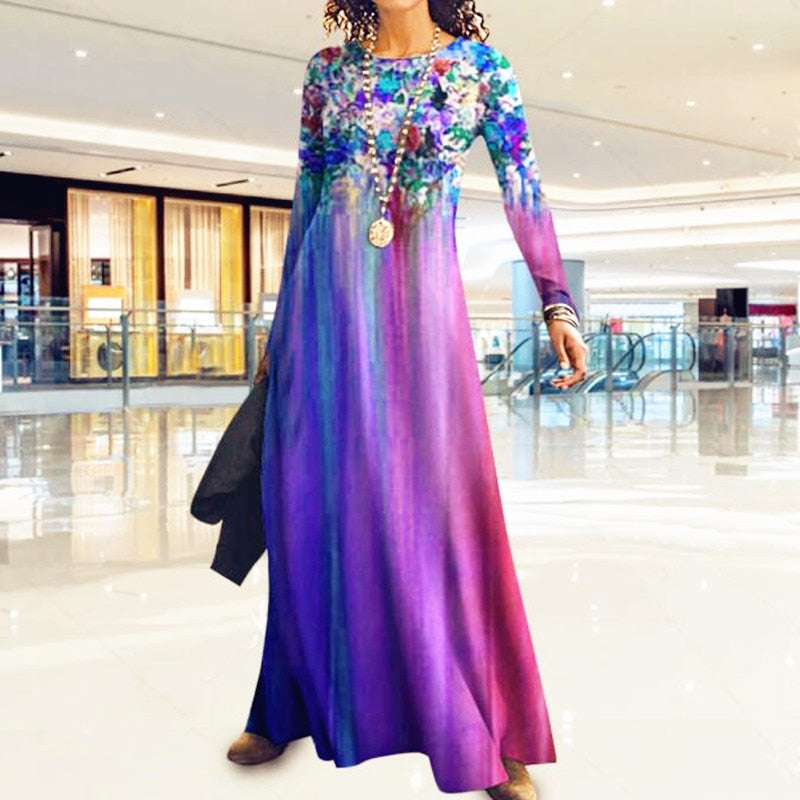 Long sleeve maxi dress in blue and purple gradient, featuring a floral print at the top, made from lightweight fabric, perfect for vintage-inspired fashion.
