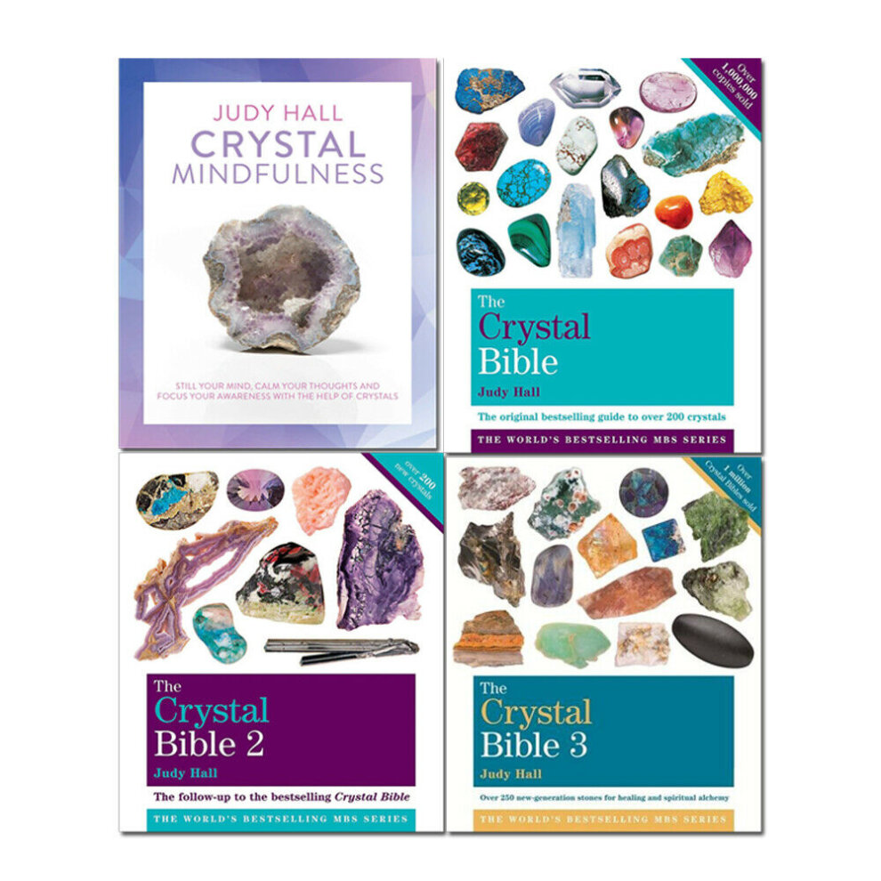 Four paperback books featuring colorful crystal images and titles in bold text, including "Crystal Mindfulness" and three volumes of "The Crystal Bible" by Judy Hall.