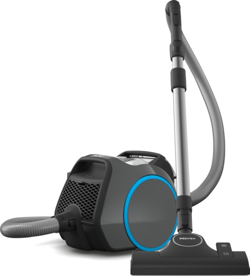 Miele Boost Cx1 bagless cylinder vacuum cleaner in grey with a sleek design, featuring a blue accent, a flexible hose, and a flat nozzle attachment.