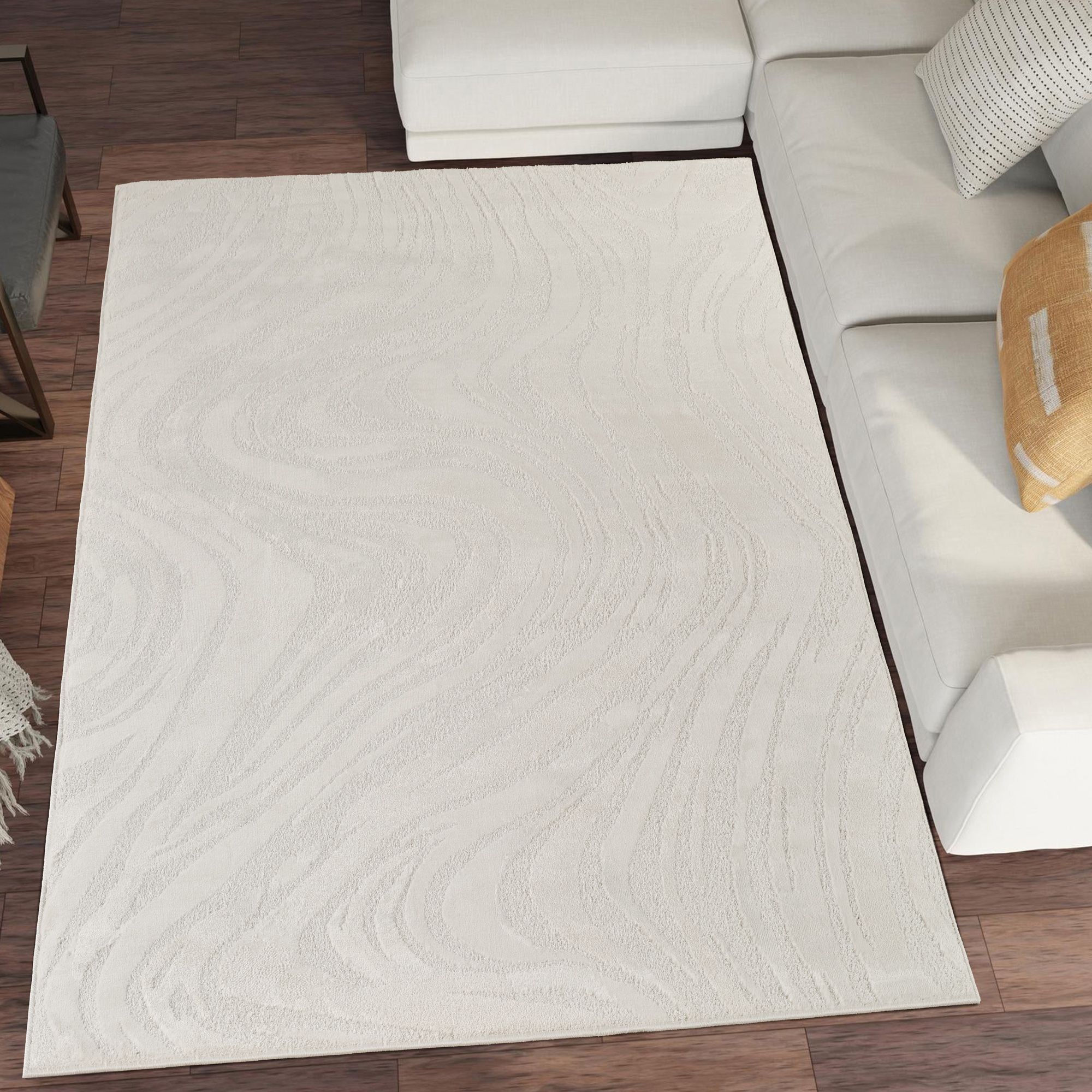 Cream area rug with a marble-inspired design featuring a metallic sheen, measuring 80cm x 150cm, placed on a wooden floor beside a light-colored sofa.