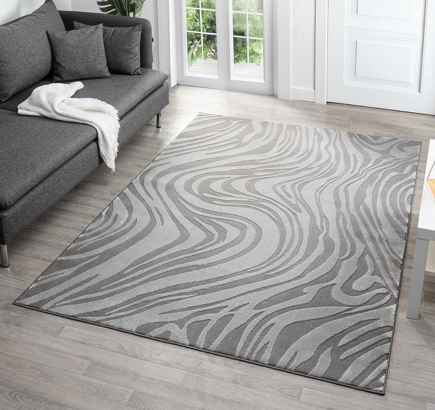 Modern anthracite area rug with embossed metallic sheen and marble design, featuring flowing purple patterns, perfect for indoor living spaces, measuring 60x220 cm.