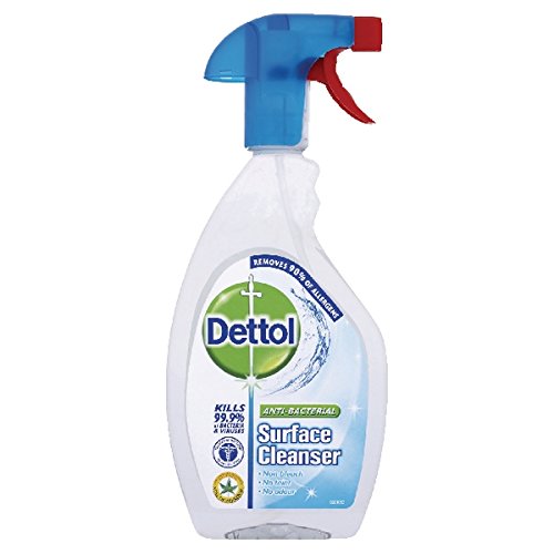 Clear plastic spray bottle with a blue trigger and red nozzle, labeled "Dettol Anti Bacterial Surface Cleaner 500ml," featuring a green logo and claims of 99.9% germ kill.