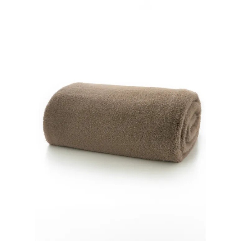 Soft, rolled faux fur throw in a fawn beige color, featuring a plush texture ideal for warmth and comfort.