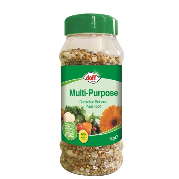 Doff Multipurpose Controlled Release Fertiliser in a clear plastic jar with a green lid, featuring colorful granules and images of fruits, vegetables, and flowers on the label.