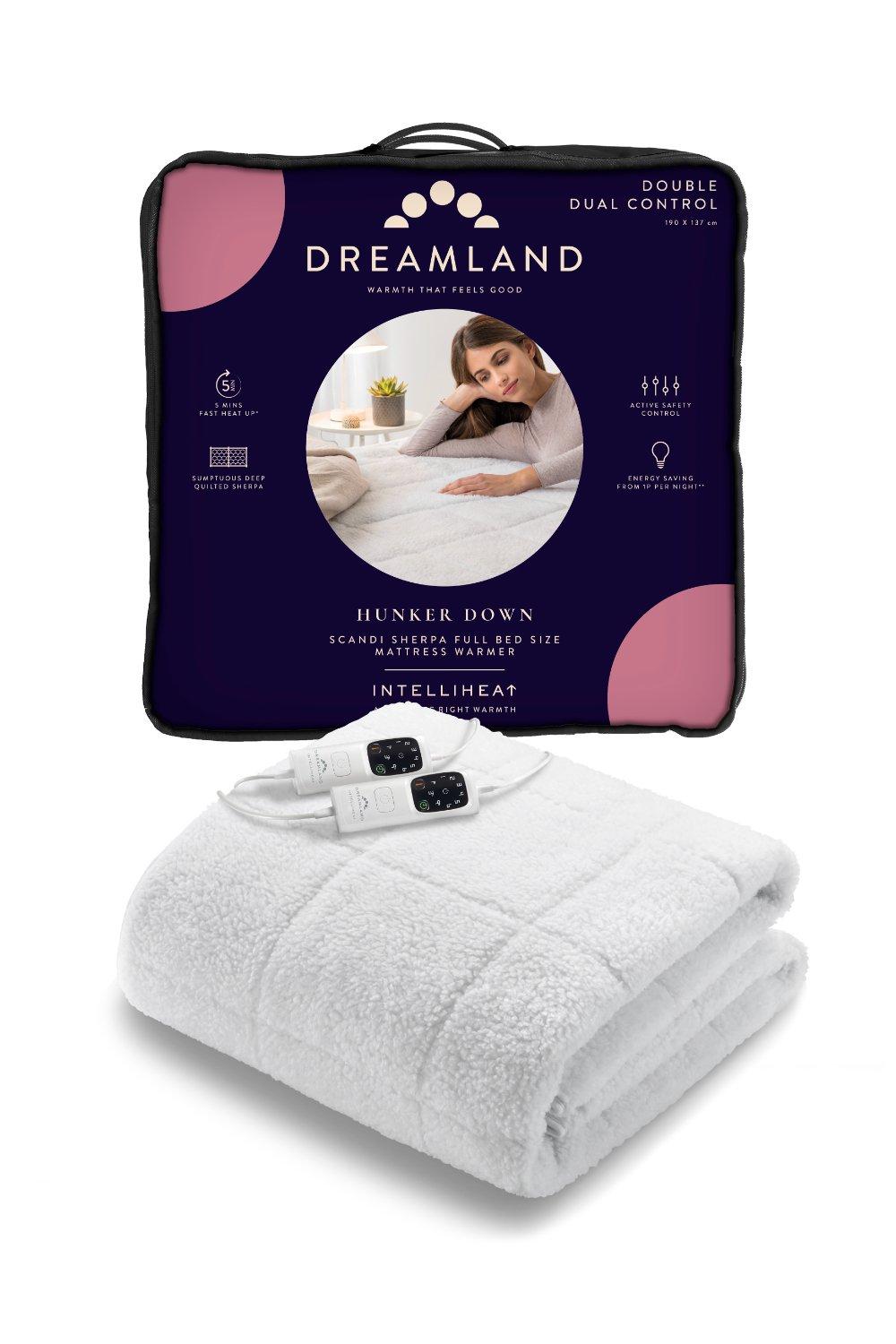 Soft white sherpa underblanket with a plush texture, featuring a dual control electric heating feature, packaged in a vibrant pink and purple box labeled "Dreamland Hunker Down."