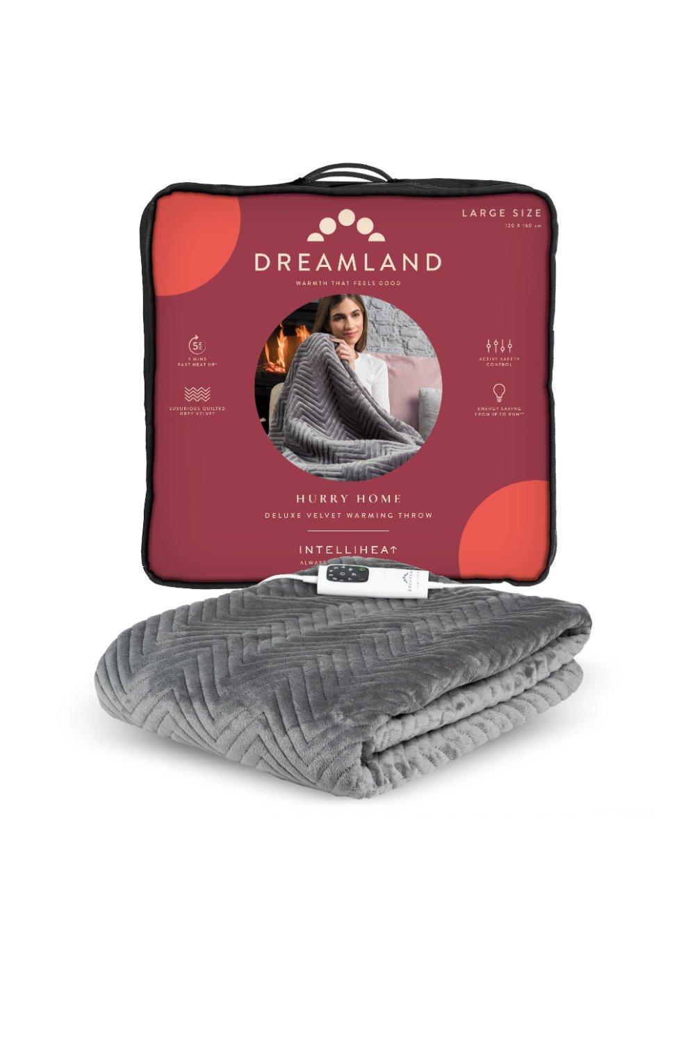Deluxe velvet herringbone heated throw in grey, featuring a soft texture and cozy design, packaged with a red and black label highlighting its key features.