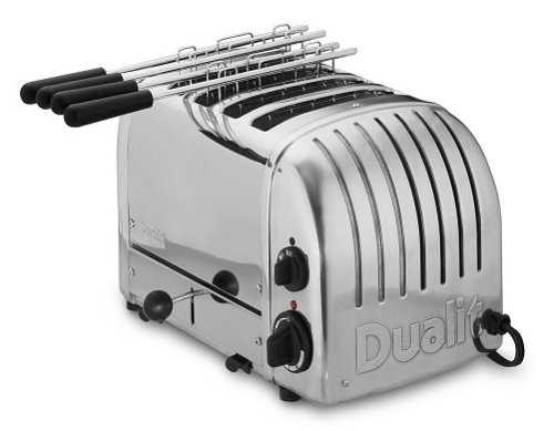 Stainless steel Dualit 2 X 2 Combi Vario toaster with four slots, adjustable browning control, and chrome finish, featuring a retro design and black handles.