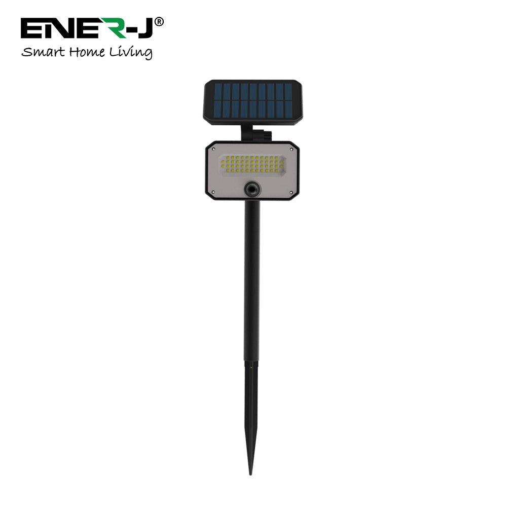 Ener-J 8W PIR solar floodlight features a black metal body, a rectangular solar panel on top, and a bright white LED light, designed for outdoor use with a ground stake for easy installation.