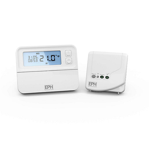 White battery-powered wireless programmable thermostat with a digital display showing time and temperature, accompanied by a matching receiver unit with indicator lights.