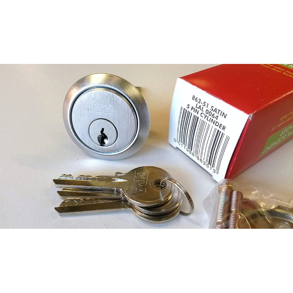 Satin chrome replacement rim cylinder with a keyhole, accompanied by three keys and packaging box featuring red and green colors, labeled with "ERA 863-51."