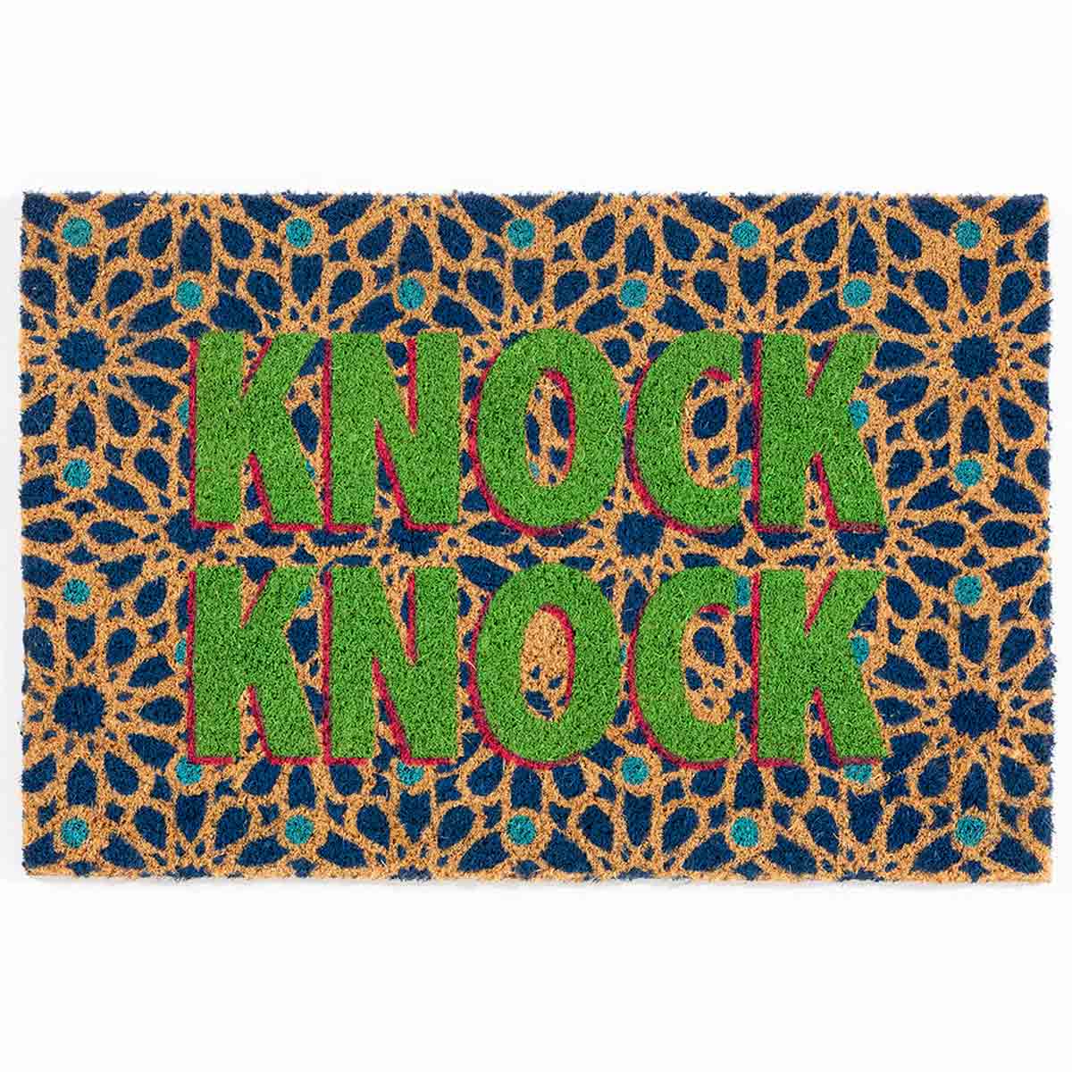 Rectangular coir doormat featuring a vibrant blue background with a floral pattern, prominently displaying the words "KNOCK KNOCK" in bold green letters.