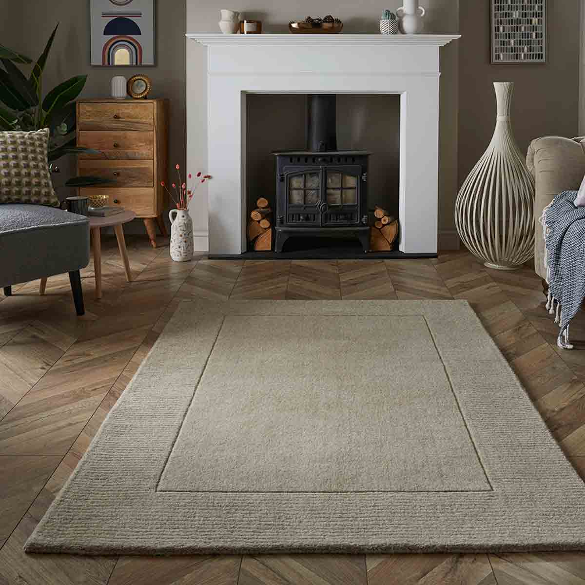 Soft stone wool rug in a subtle pink hue, measuring 80x150cm, featuring a textured surface and bordered design, perfect for adding warmth to any living space.