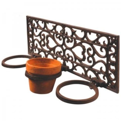 Brown cast-iron flower pot holder featuring an ornate design, with three circular rings for pots and a decorative back panel.