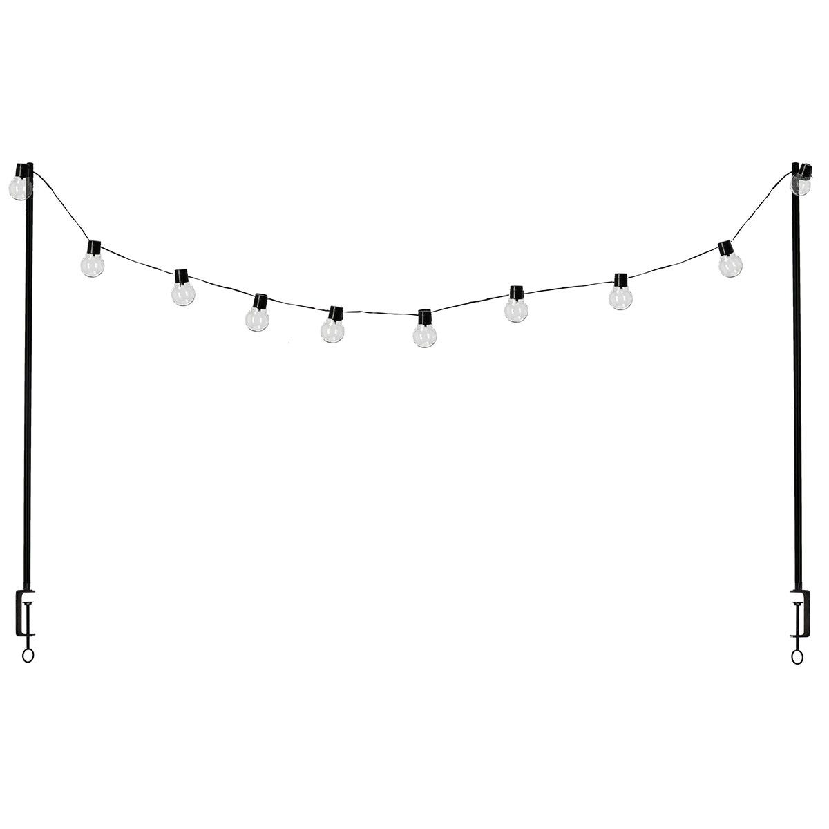 Black metal table clamp with solar-powered string lights, featuring clear glass bulbs, designed for outdoor use, ideal for creating ambient lighting.