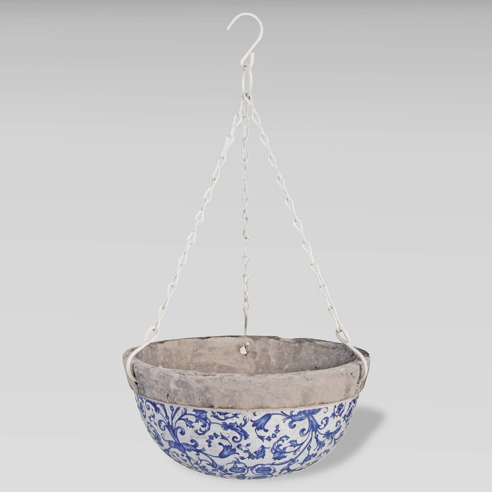 Ceramic hanging flower basket featuring a blue and white floral design with a white metal hook and chain for easy suspension.