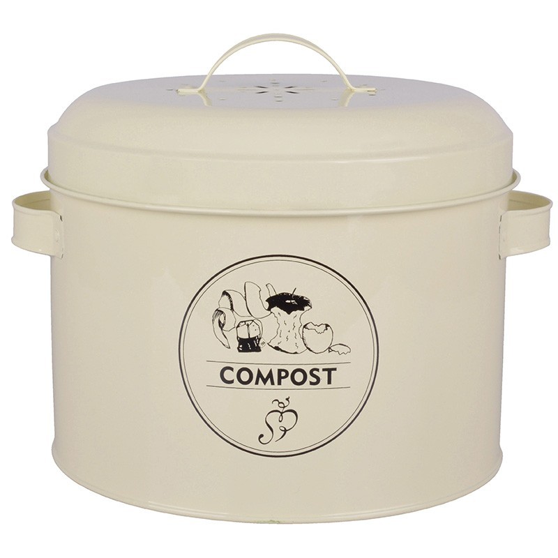 Cream-colored carbon steel composter tin with a lid, featuring a handle and a black "COMPOST" graphic on the front, along with ventilation holes on top.