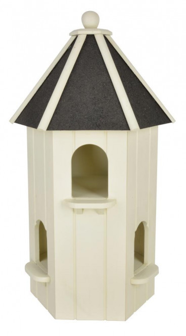 White wooden pigeon house with a black slanted roof, featuring two arched entryways and a round finial on top, designed for outdoor use.
