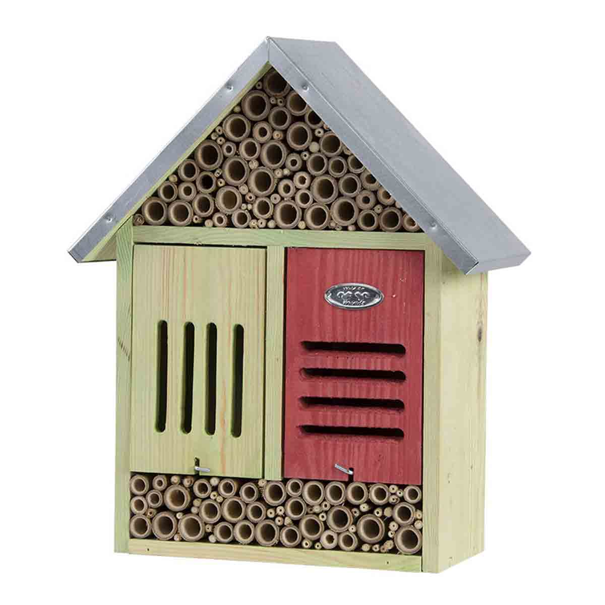 Extra large wooden insect hotel featuring a green and red exterior, a sloped metal roof, and multiple bamboo tubes for insect habitats, accompanied by a cleaning brush.
