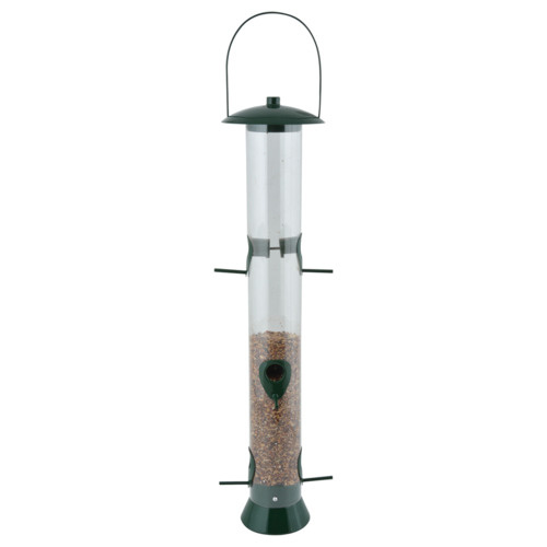Transparent cylindrical bird feeder with a green metal top and base, featuring feeding ports and a hanging handle, filled with mixed birdseed.