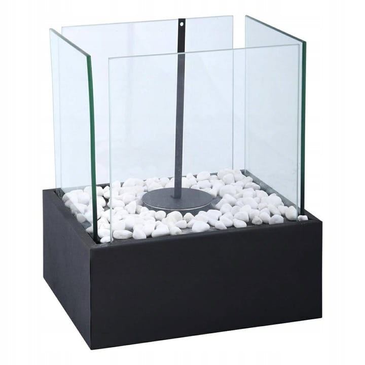Square black bioethanol burner with a sleek metal base, surrounded by white pebbles and encased in transparent glass panels, designed for outdoor or indoor use.