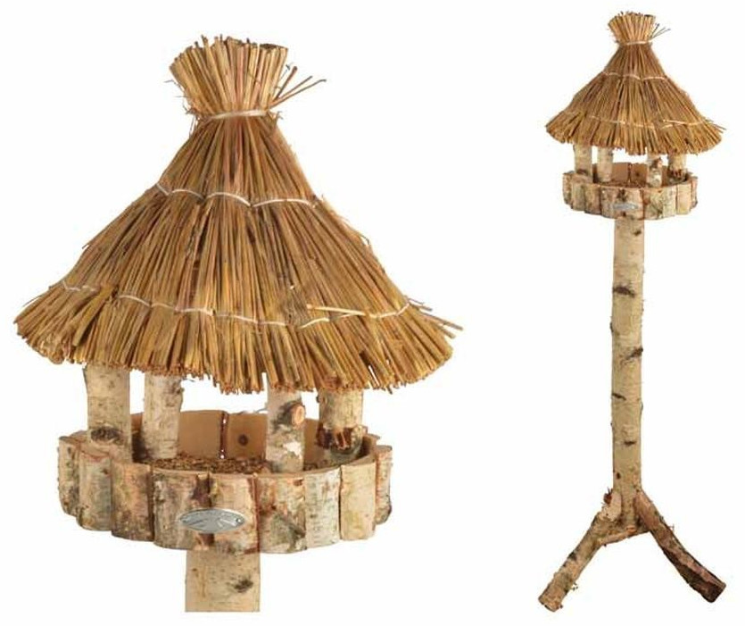 Wooden bird feeder with a thatched roof, featuring a circular base made of birch logs, supported by a sturdy, natural wood pole.
