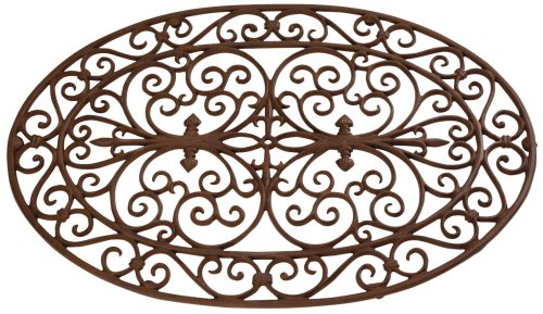 Oval cast iron doormat featuring intricate scrollwork designs, finished in a rich brown color, measuring 29" x 19" by Esschert Design.