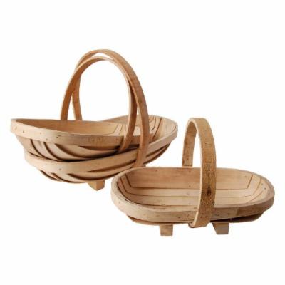 Two natural wicker baskets with curved handles, featuring a light wood finish and a woven design, one larger and one smaller, ideal for storage or decorative use.
