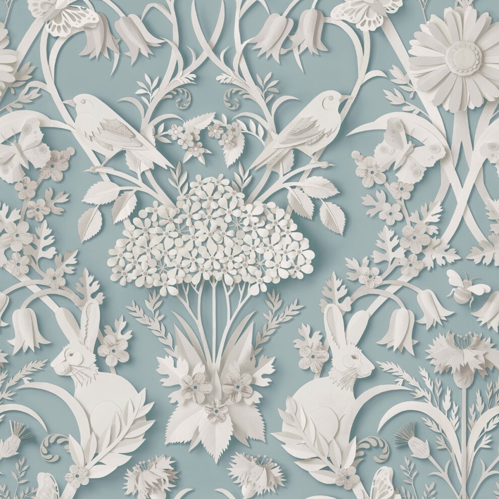 Light blue wallpaper featuring intricate white floral and animal designs, including rabbits and birds, with a textured, layered appearance.