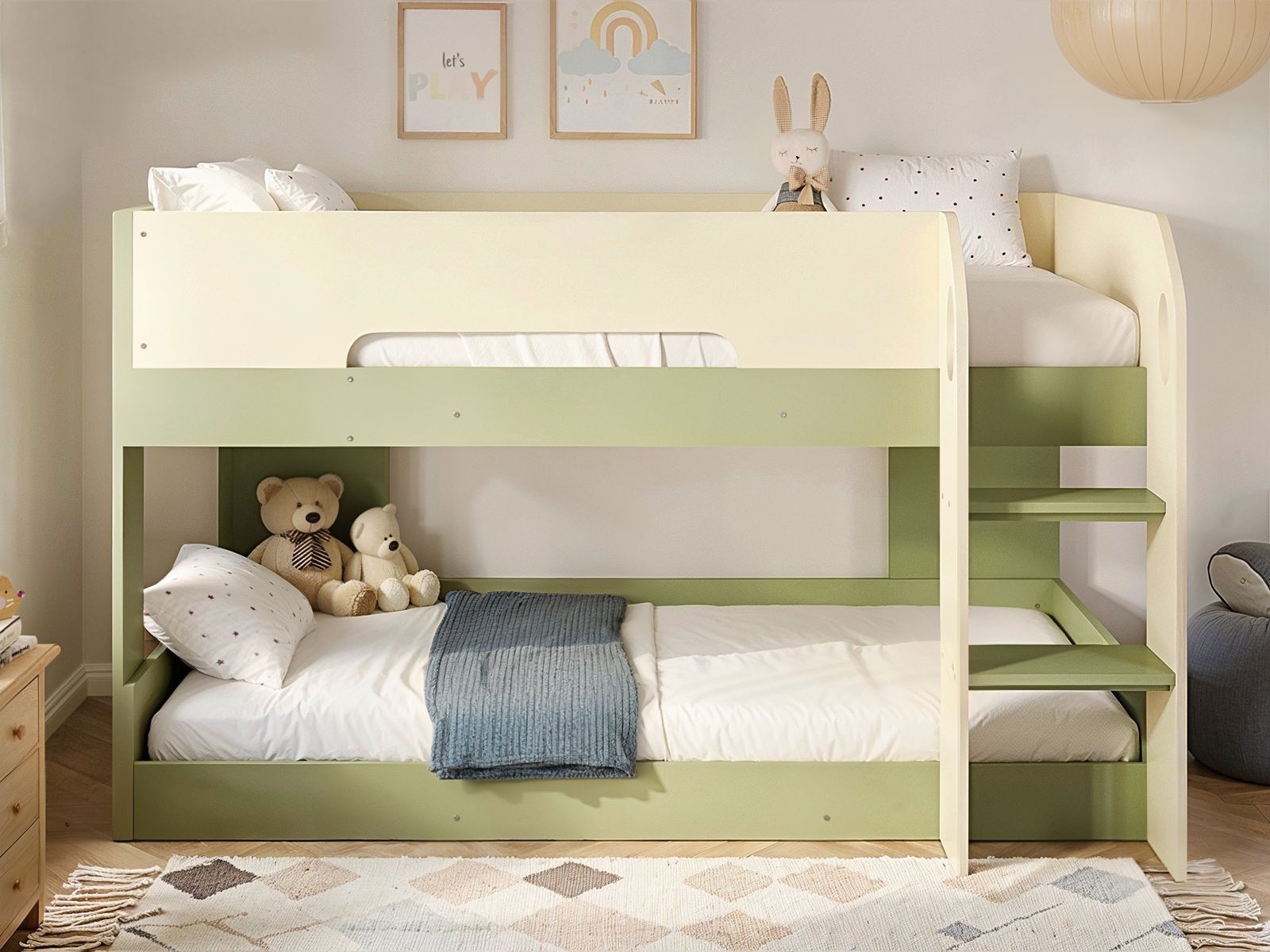 Low pod bunk bed in soft green and cream, featuring a sturdy wooden frame, two mattresses, a cozy blanket, and plush toys on the upper and lower levels, with a gentle, modern design.