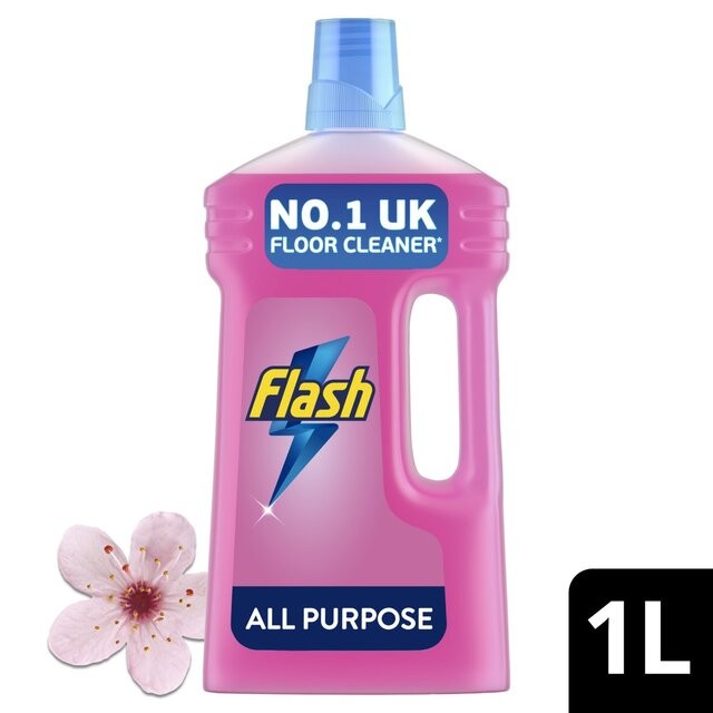 Pink plastic bottle of Flash Blossoms & Breeze Liquid, 1000ml, featuring a blue cap, bold "Flash" logo, and a cherry blossom flower beside it.