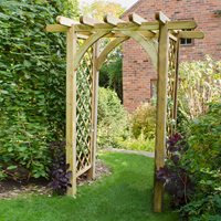 Large wooden garden pergola arch in natural wood finish, measuring 8' x 4', featuring an arched top and lattice side panels, surrounded by lush greenery.
