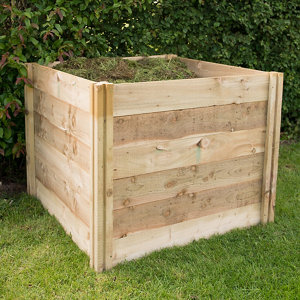 Wooden compost bin made from natural timber, measuring 1.06x1.06m, featuring slatted sides and a square design, filled with organic material, set on green grass.