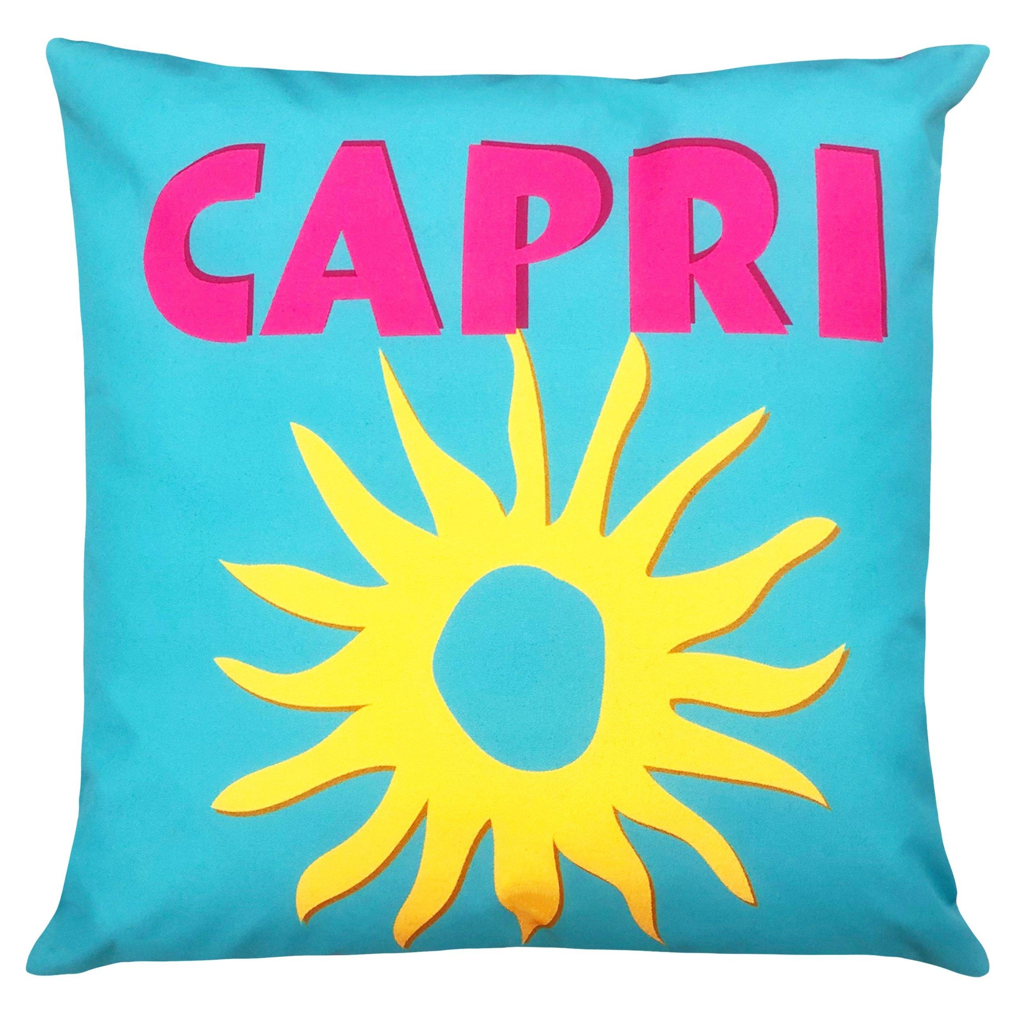 Multicoloured outdoor cushion featuring a bright turquoise background, bold pink "CAPRI" text, and a vibrant yellow sun design, made from durable fabric for outdoor use.