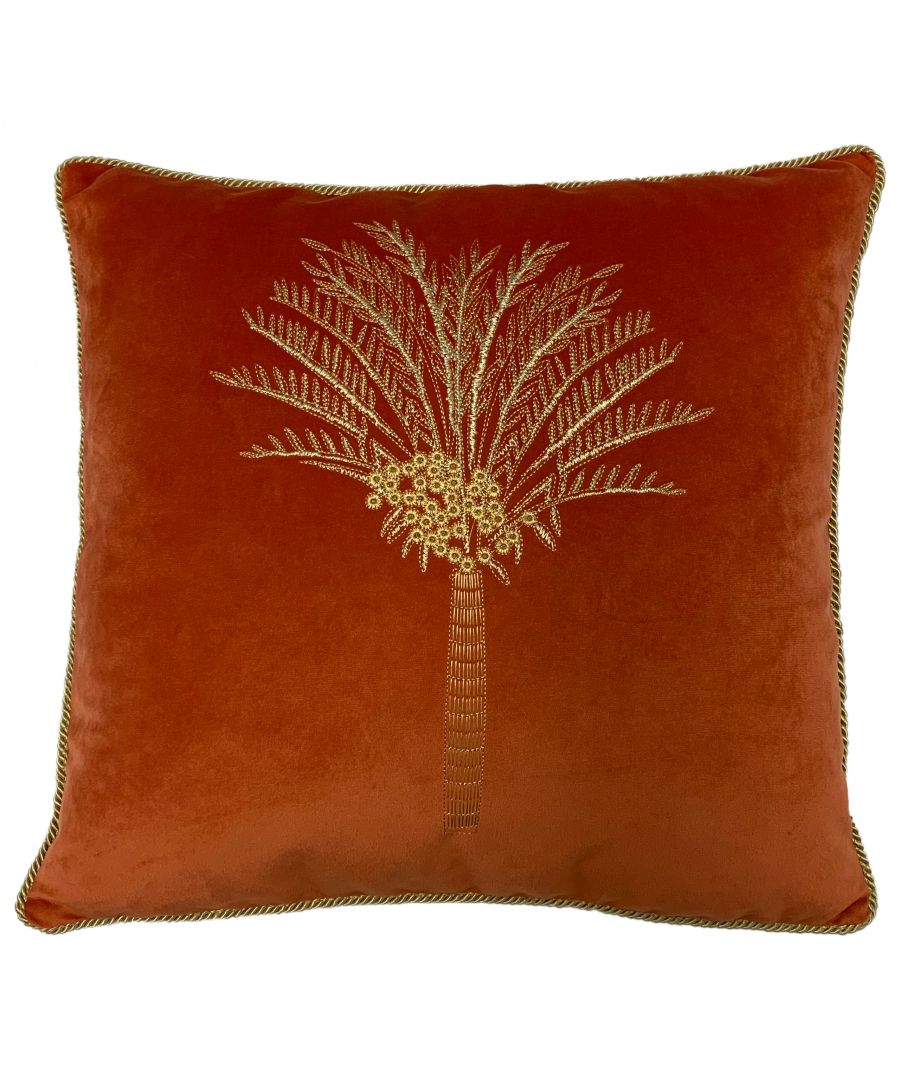 Coral cotton cushion measuring 50 cm x 50 cm, featuring a decorative palm tree embroidery in gold on a plush velvet surface with a contrasting trim.