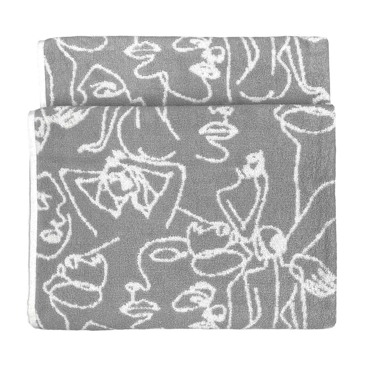 Grey cotton bath towel featuring an abstract jacquard design with white line art of faces, folded neatly with a soft texture.