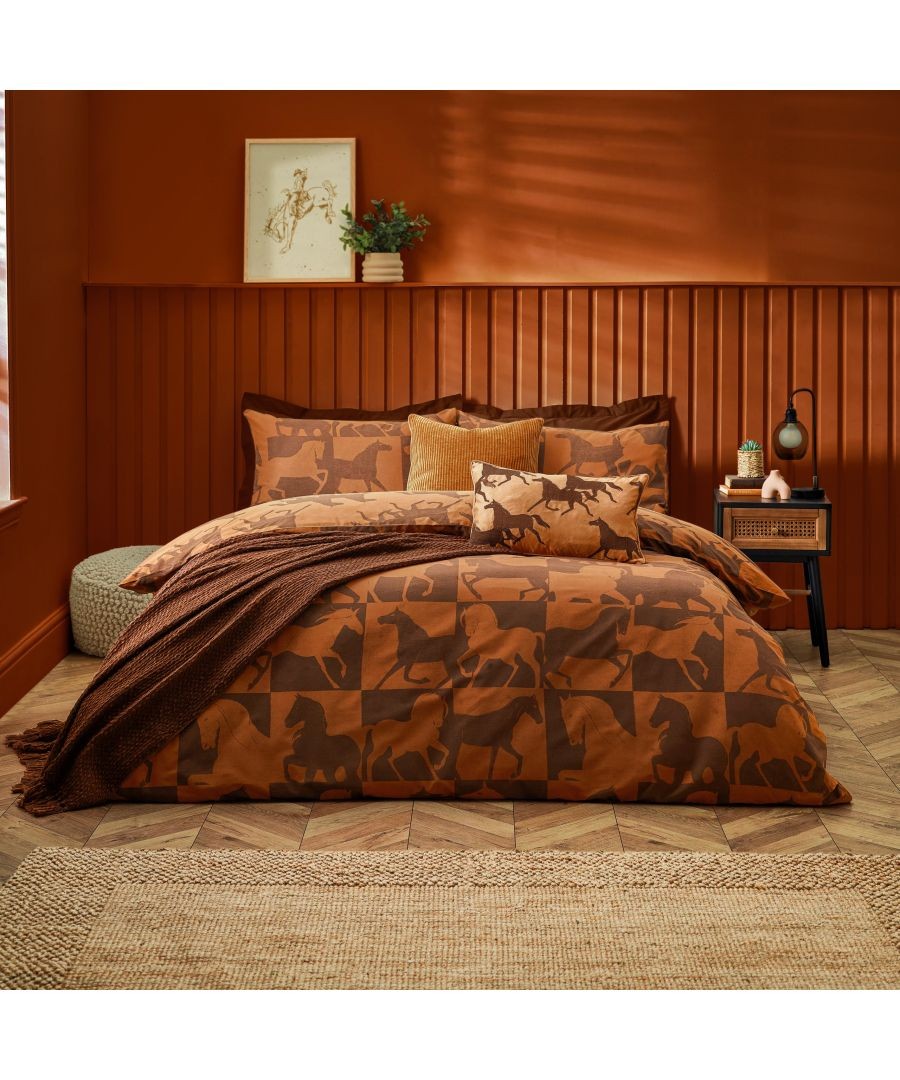 Cozy bedding set featuring a warm brown color palette with horse silhouettes, complemented by textured cushions and a knitted throw, set against an earthy orange wall.