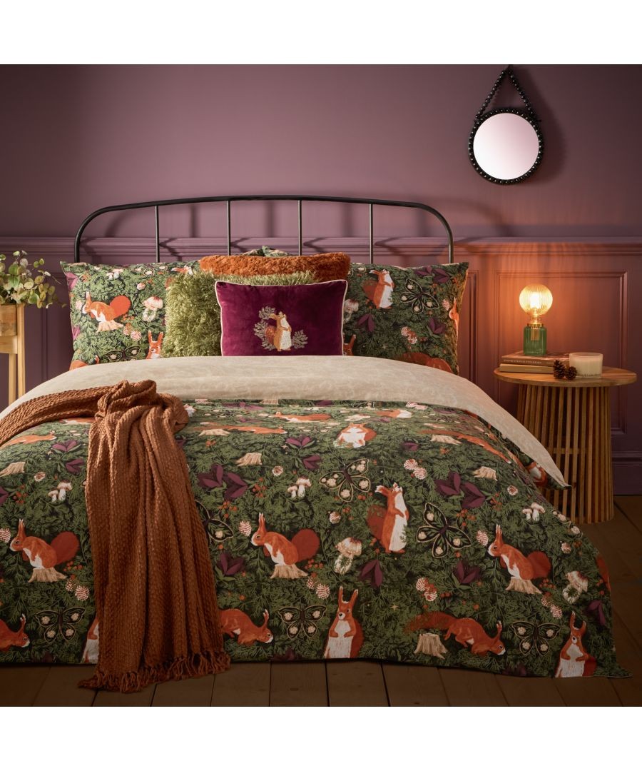 Colorful duvet set featuring a woodland theme with rabbits and foliage, set against a deep green background, complemented by plush pillows and a cozy throw.