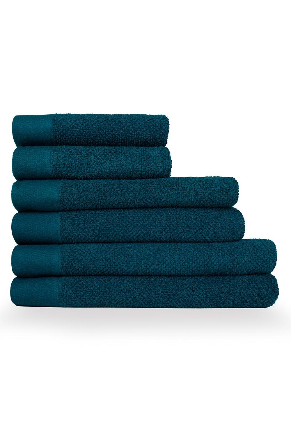 Six-piece towel bale featuring textured weave in a rich teal color, made of soft cotton, including hand towels, bath towels, and sheets with a smooth contrasting border.