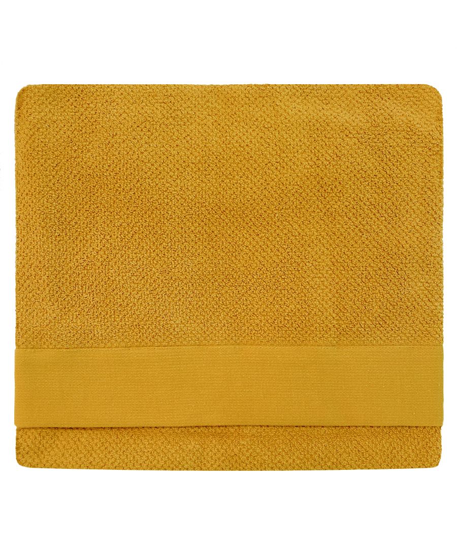 Textured yellow cotton bath sheet featuring a soft weave and a smooth, solid band at one end, designed for comfort and absorbency.