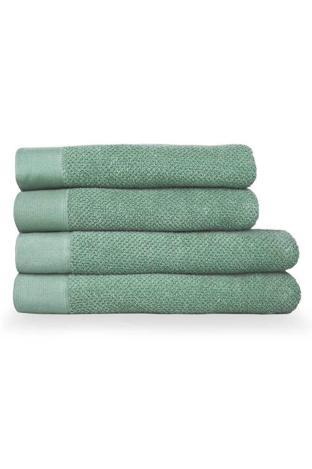 Textured towel bundle in smoke green, featuring four pieces with a soft, plush surface and contrasting smooth edges, ideal for bath or hand use.