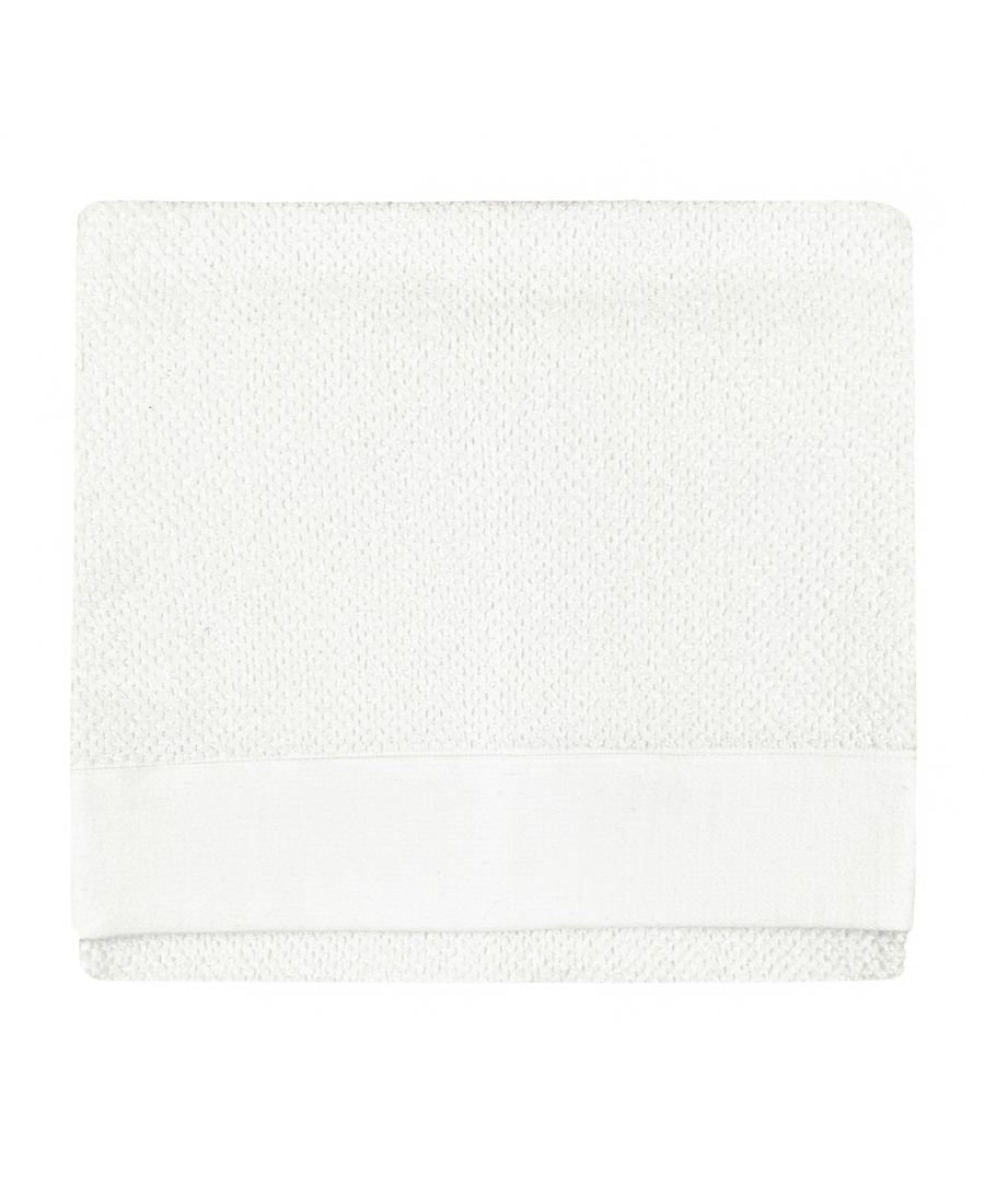 Textured white cotton bath towel featuring a woven design and a smooth border, designed for versatile use in any bathroom setting.