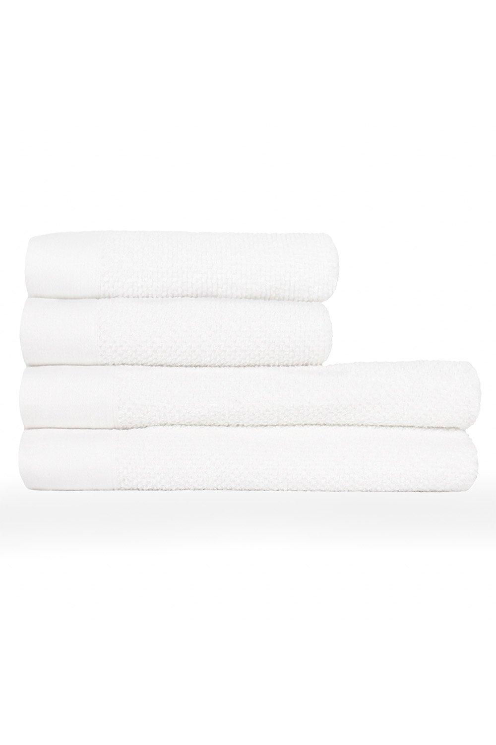 Four stacked white cotton towels featuring a textured weave and Oxford panel design, suitable for hand or bath use.